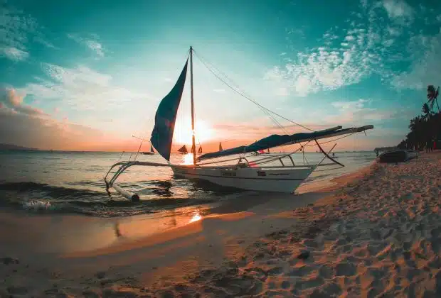 white boat docked on seashore